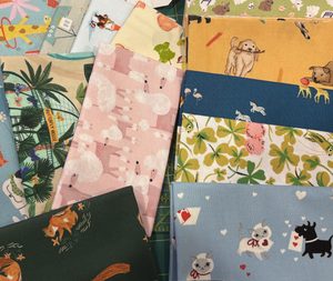 multiple samples of fat quarters of fabric.